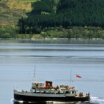 LOOKING TO THE BAY AT DRUMNADROCHIT WHERE THE PLEASURE CRUISER, "THE JACOBITE QUEEN" SAILS ON LOCH NESS,