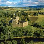 Doune Castle is a medieval stronghold near the village of Doune, in the Stirling district of central Scotland. The castle is sited on a wooded bend where the Ardoch Burn flows into the River Teith